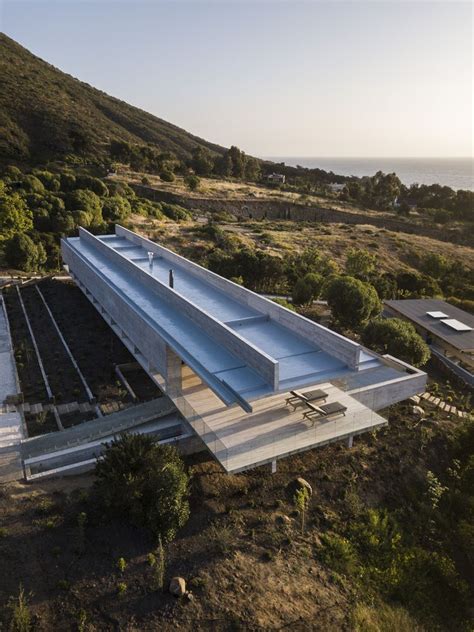 An Elongated Concrete House Sits Along The Chilean Coastline