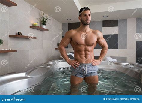 Man Flexing Muscles In Jacuzzi Spa Stock Photo Image Of Leisure