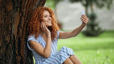 Pleased Redhead Woman Taking Selfie While Stock Image Image Of Green Device 240378419