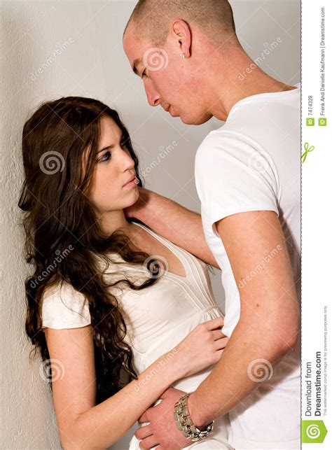 Young Couple Passionate Love Against A Wall Royalty Free