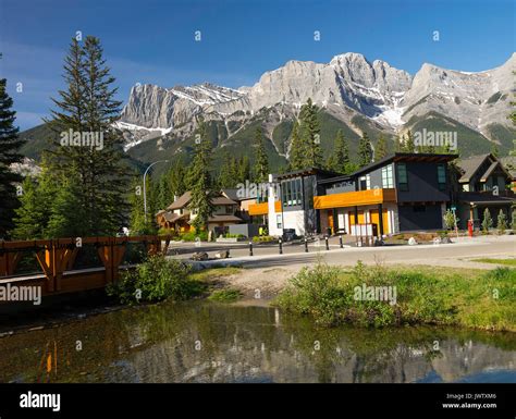 Beautiful Housing And Rocky Mountain Scenes And Pine Forest In Canmore