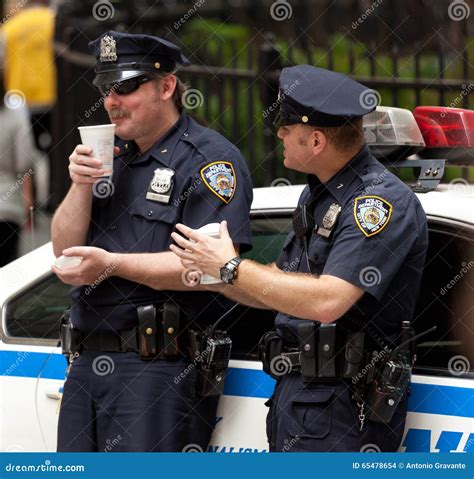 Two Police Officers While Drinking A Cup Of Coffee In Nyc Editorial Stock Image Image Of Duty