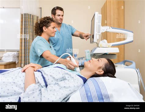 Nurses Performing Ultrasound Procedure Stock Photo Alamy