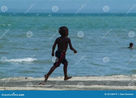 A Young Black Boy Running On Beach Editorial Stock Image Image Of