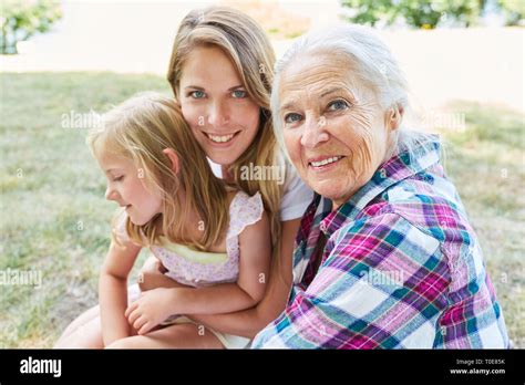 Senior Woman As Grandmother Together With Her Daughter And