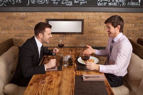 Two Friends Sitting In Cafe And Eating Lunch Stock Photo Image 43626122