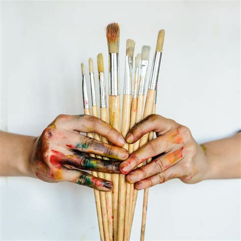 Close Up Of An Artistpainter Hands Holding Paint Brushes Stock Image