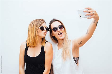 View Two Women Taking A Selfie With Your Mobile Phone By Stocksy