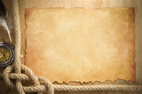 Ship Ropes And Compass At Parchment Old Paper Powerpoint Presentation