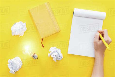 Cropped View Of Woman Writing In Blank Notebook Crumbled Paper Balls