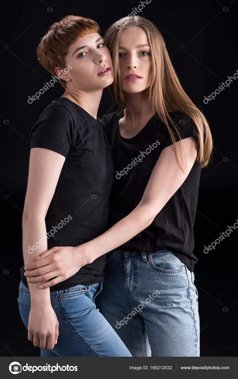 Lesbian Couple Touching Cheeks Stock Photo By DimaBaranow