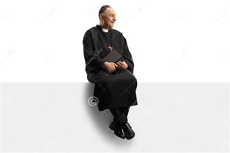 Full Length Shot Of A Mature Priest Sitting On A Blank Panel Stock Image Image Of Full