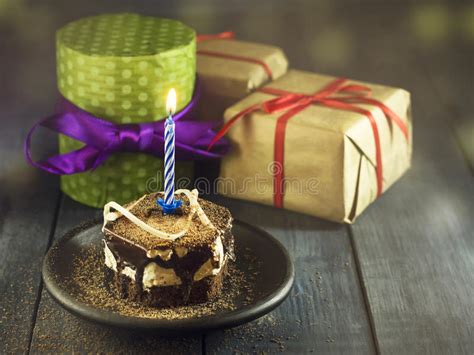 High quality chocolates handmade in our workshop in limburg, you can't go wrong! Chocolate Cake With A Candle And Gifts.Happy Birthday ...