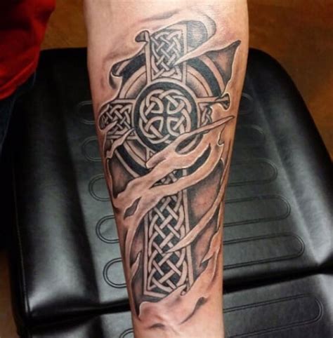 Usually celtic cross tattoo design are large in size but you try a mini celtic cross tattoo on shoulder like this. Celtic Tattoos for Men - Ideas and Inspiration for Guys