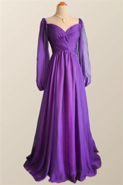 The Elegant Purple A Line Long Formal Dress Features A Sweetheart Neck Long Sleeves And Zip Up