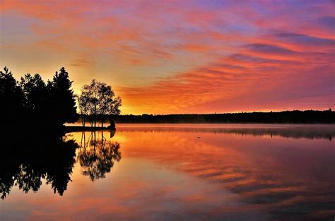 Sunrise Over Lake Photograph By Roxanne Distad