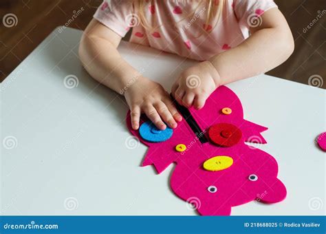 Little Toddler Girl Buttoning A Montessori Toy Stock Image Image Of