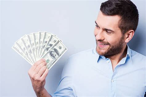 Royalty Free Man Holding Money Pictures Images And Stock Photos Istock