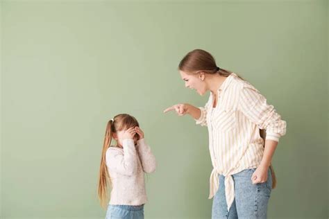Angry Mother Scolding Her Little Daughter On Color Background Stock