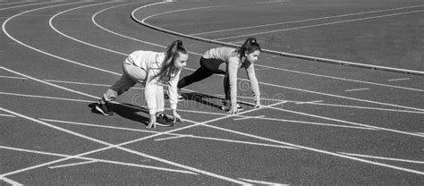 Healthy Children Girls Training Run On Stadium Running Track Sport