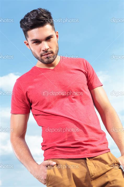 Casual Man Looks Down With Hand In Pocket Stock Photo By ©feedough 30364623