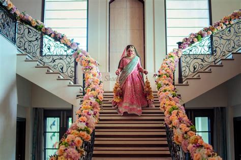An elegant and floral arrangement. Top 14 Staircase Decor Ideas to elevate your wedding decor ...