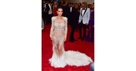 Kim Kardashian Adorned Her Curves With Feathers And Embellishments In The Naked Dress Trend In