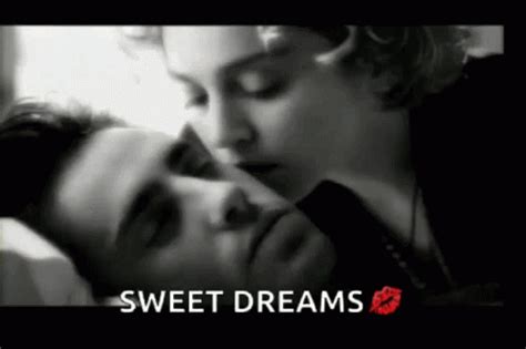 Two People Are Kissing Each Other With The Words Sweet Dreams In Front