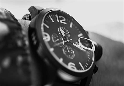 Close Photograph Person Wearing Round Bezel Chronograph Watch