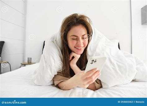 Portrait Of Gorgeous Girl Wakes Up In Morning Lying In Bed With