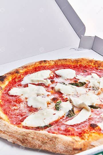 Single Margherita Italian Pizza On Delivery Box Isolated Over White