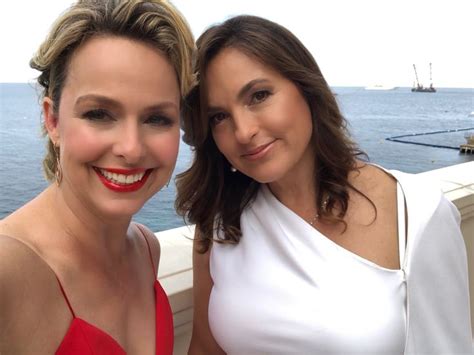 Two Women Standing Next To Each Other In Front Of The Ocean On A Cruise Ship