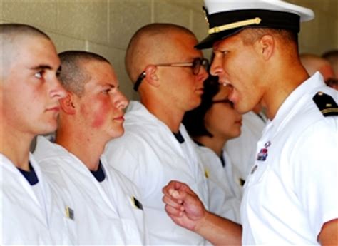 A U S Naval Academy Upper Class Midshipman Instructs A Plebe