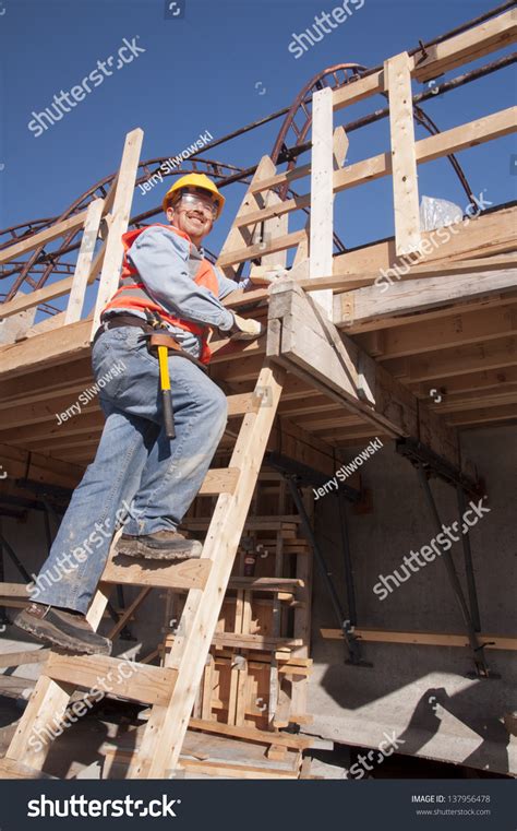 Construction Worker Climbing Ladder