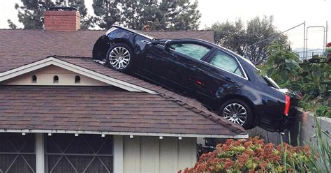 Mans Car Lands On Neighbors Roof In Strange Accident