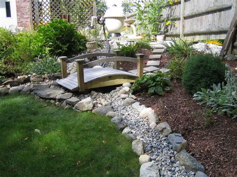 Find out how watering your grass can keep your lawn lush and beautiful! Dry river bed to direct waste water away from lawn when back wash pool pump | Dry river, River ...