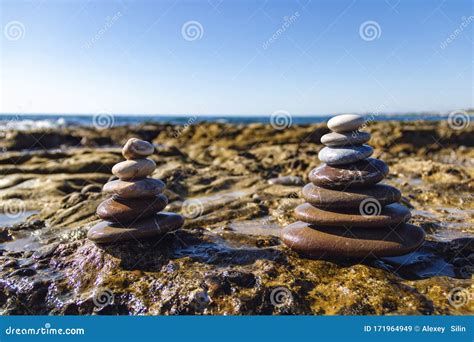 Pyramids Of Stones For Meditation Lying On Sea Coast Stack Of Stones