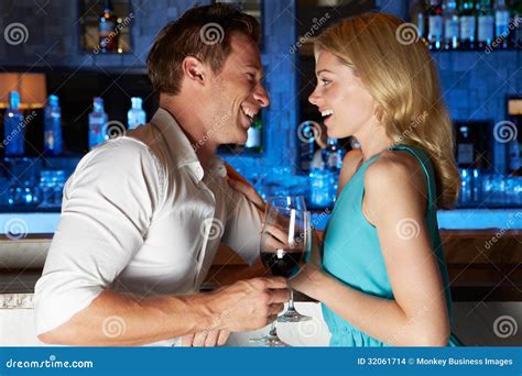 Couple Enjoying Drink In Bar Stock Photo Image Of Wine Clothing