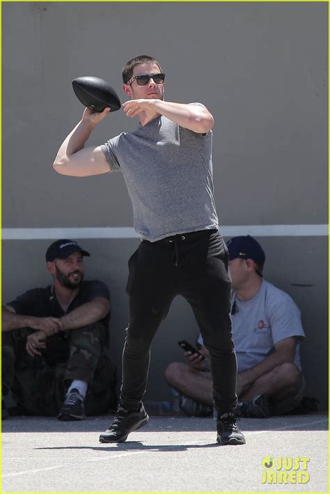 Nick Jonas Bicep Bulges Through His T Shirt During Football Toss