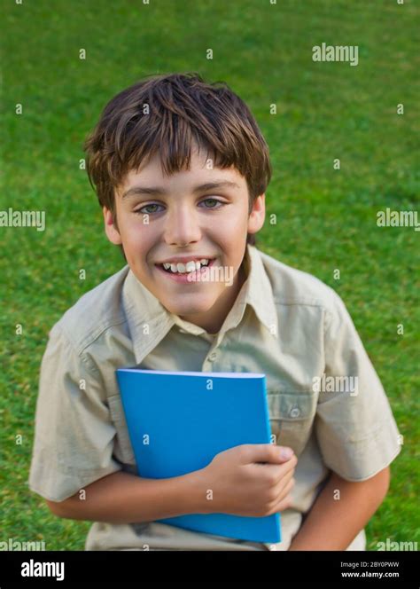 Happy Boy With Book Stock Photo Alamy