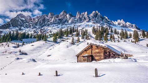 Cabin In Winter Mountains