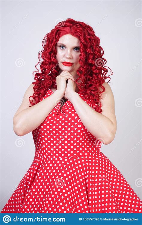 Plus Size Red Hair Curly Woman With Curvy Body Wearing Retro Polka Dot