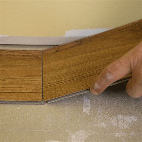 Using a block or other flat object, press the vinyl tape against the subfloor to ensure a secure bond. How to Install Vinyl Plank Flooring | Vinyl wood flooring ...