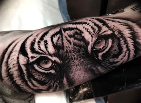 Incredible Tattoo On Tiger Eyes On Forearm