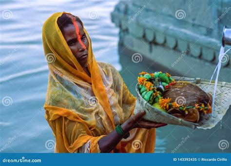 Indian Hindu Woman Devotee Offering Prayers To The Sun God During