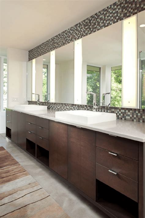 The cabinet is located at the corner most part of the bathroom with a plush mirror bordered in silver. 45 Stunning Bathroom Mirrors For Stylish Homes