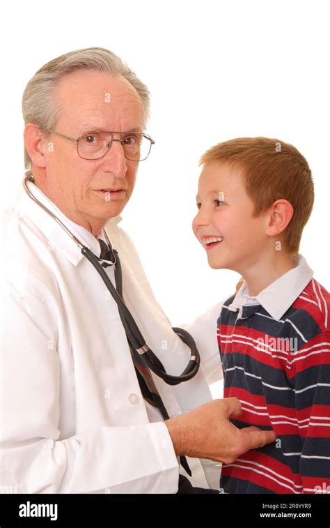 Senior Doctor Physician Isolated On White With Young Boy Patient Stock