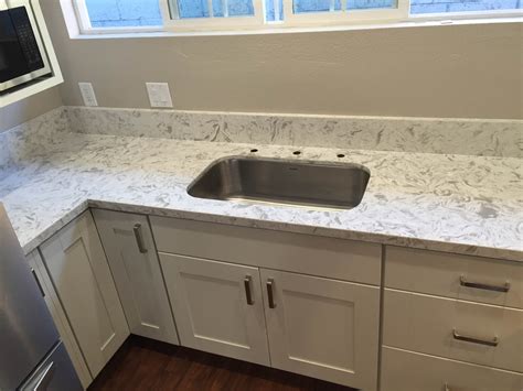 Try light gray or blue shaker cabinets, forego the hardware and add sleek white quartz countertops. kitchen white shaker cabinets & QUARTZ COUNTERTOP iN los ...