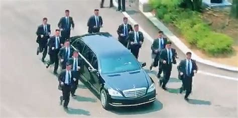 Kim Jong Uns Bodyguards Run Beside His Limo Back Into North Korea