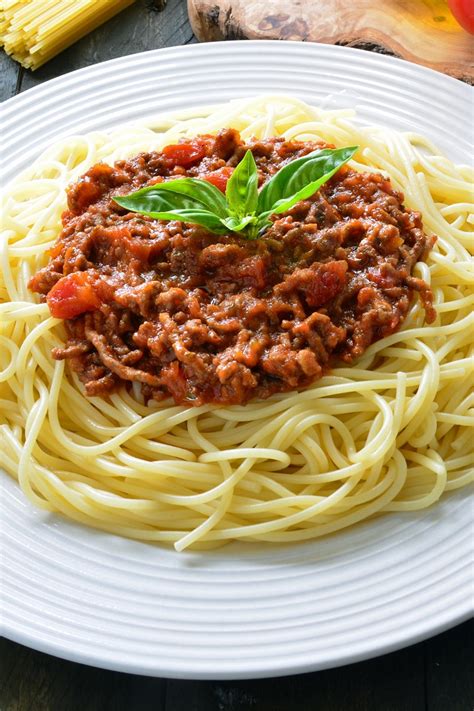 Serve with pasta, grated parmesan cheese, and garlic toast. The Best Spaghetti Bolognese | KitchMe